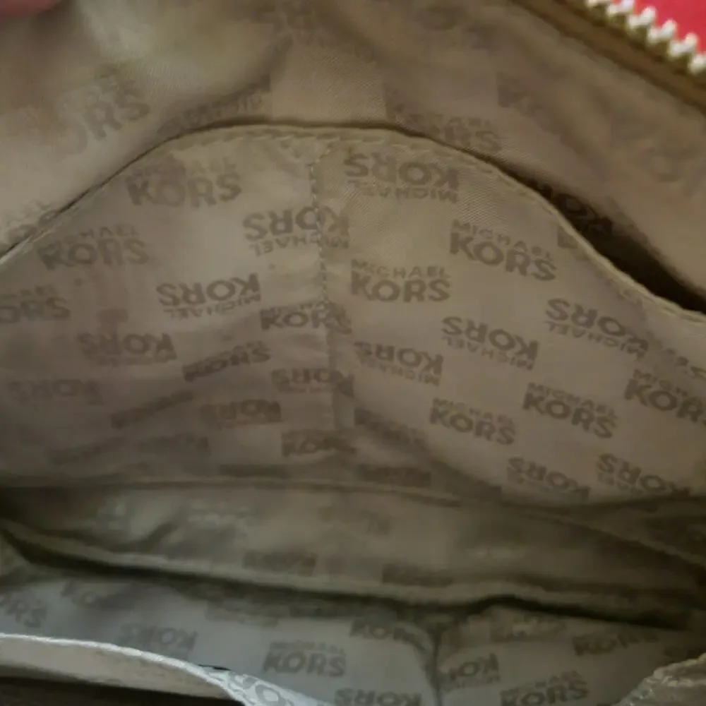 Michael Kors Jamesport Signature Handbag Tab with Leather and Gold Trim Striking